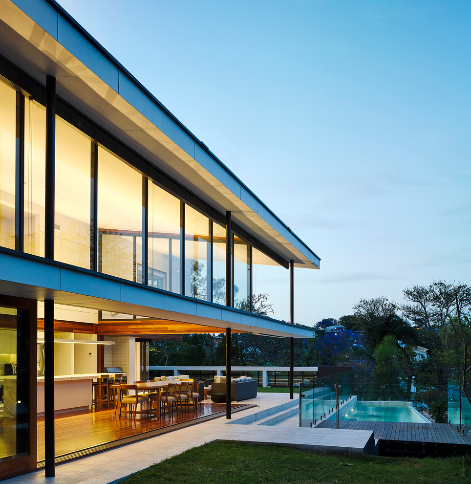 Inspiration for a contemporary two floor glass house exterior in Brisbane.