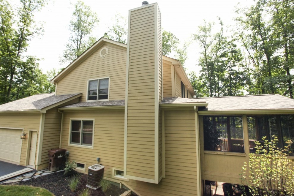 Example of a mid-sized trendy two-story exterior home design in Columbus