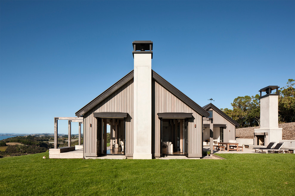 Nautical house exterior in Auckland with wood cladding and a pitched roof.