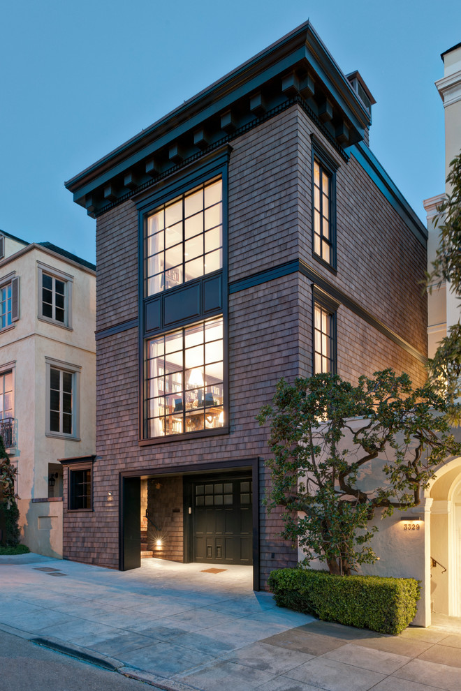 Design ideas for a classic house exterior in San Francisco with three floors, wood cladding and a flat roof.