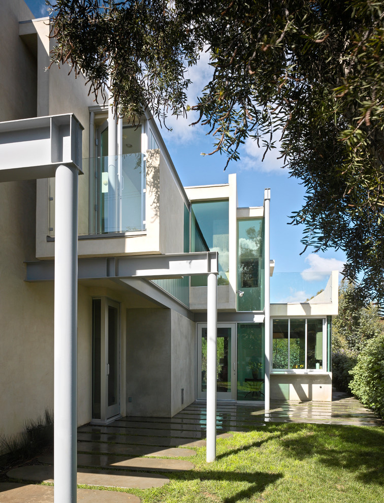 Inspiration for a contemporary gray two-story exterior home remodel in Los Angeles