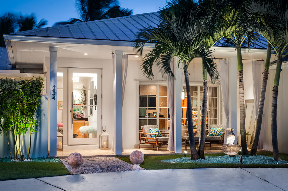 Example of a trendy white exterior home design in Miami