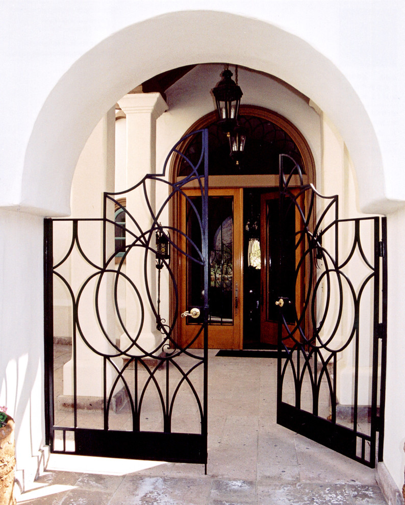Example of a tuscan white stucco exterior home design in Los Angeles