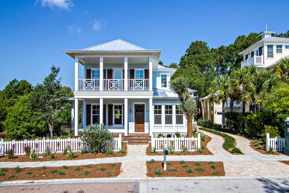 Mid-sized coastal blue two-story house exterior idea in Jacksonville with a metal roof