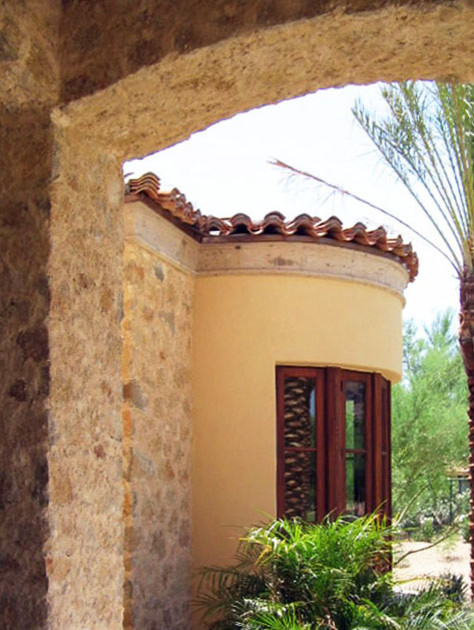 Inspiration for a large mediterranean beige two-story mixed siding exterior home remodel in Austin with a tile roof
