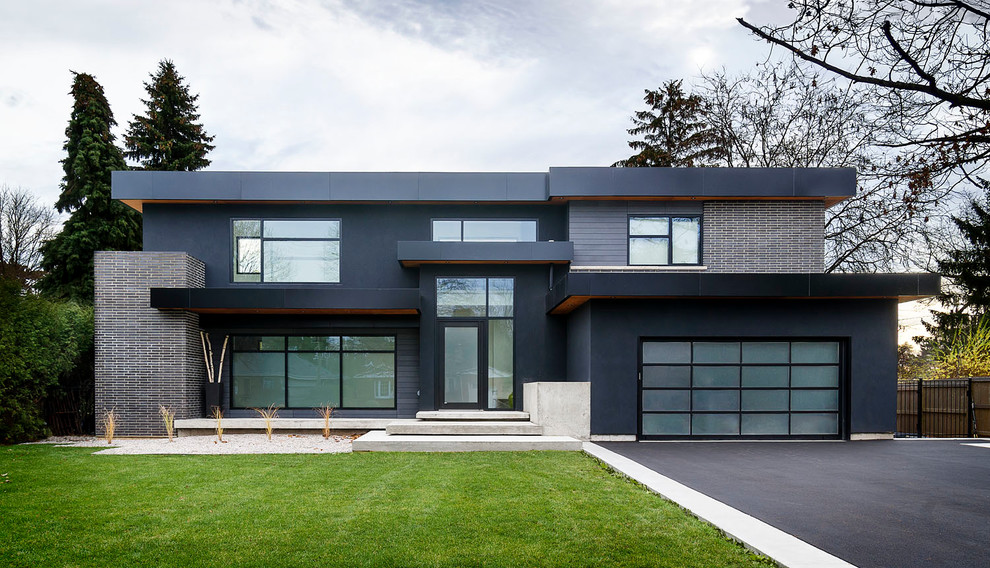 Ispirazione per la facciata di una casa grande grigia moderna a due piani con tetto piano