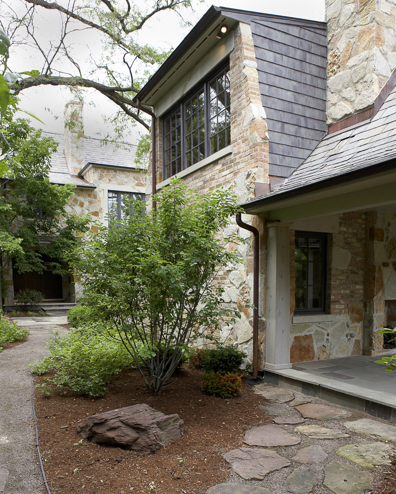 Inspiration for a timeless stone exterior home remodel in Chicago