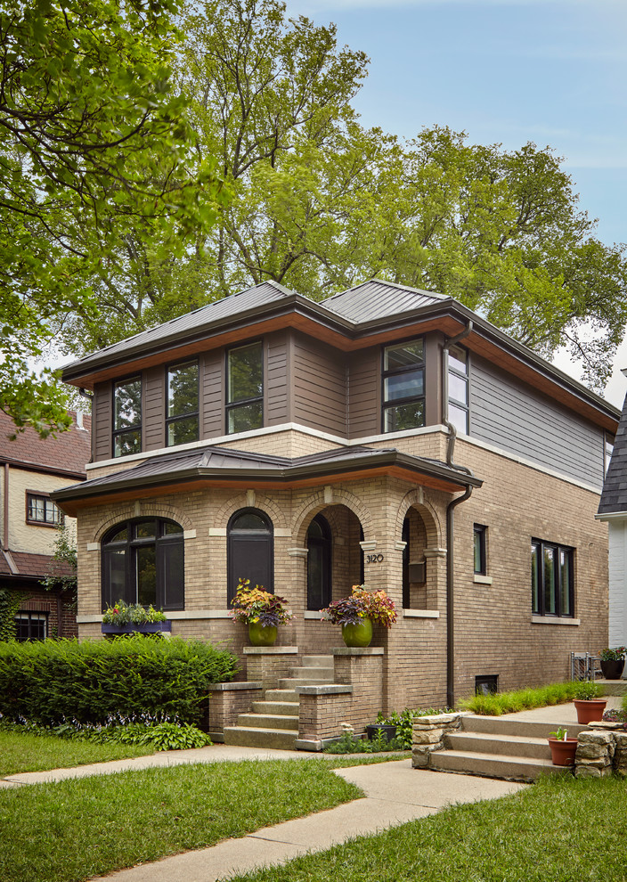 Photo of a medium sized and brown contemporary two floor house exterior in Chicago with concrete fibreboard cladding.
