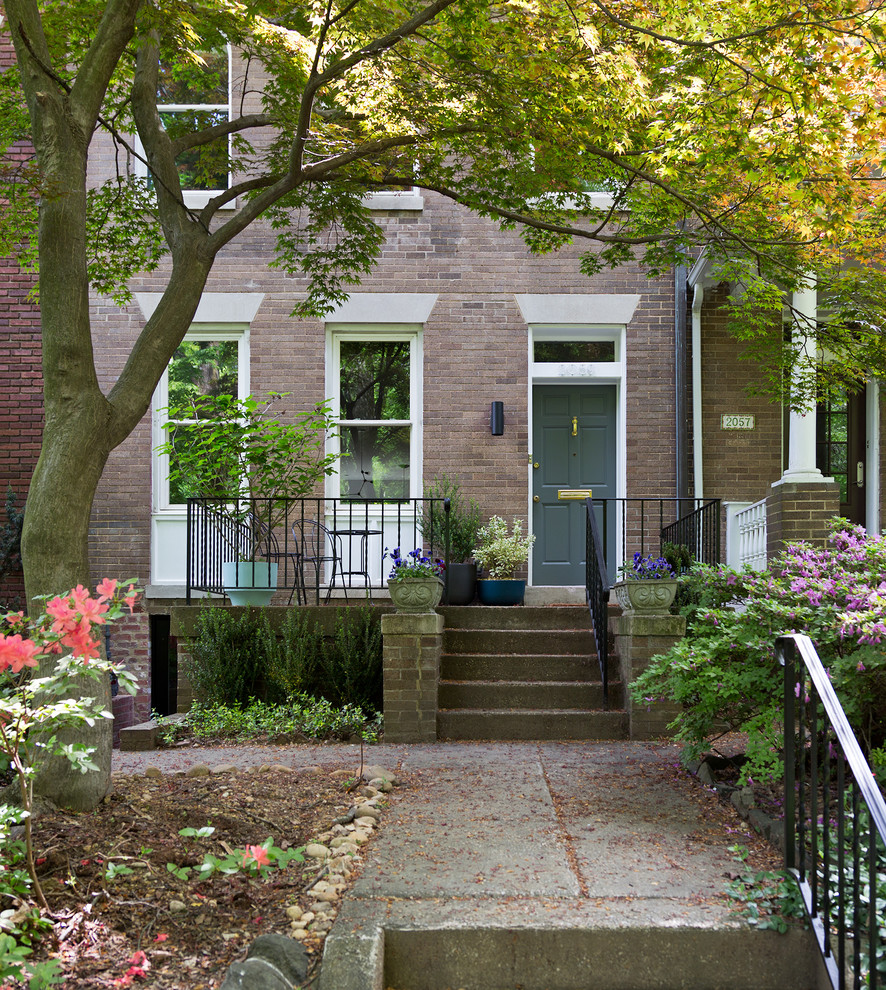 Small 1950s gray two-story brick townhouse exterior photo in DC Metro with a hip roof