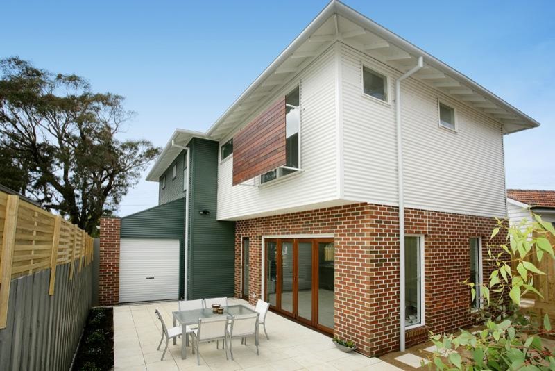 Contemporary multicolored two-story mixed siding house exterior idea in Melbourne with a hip roof and a metal roof