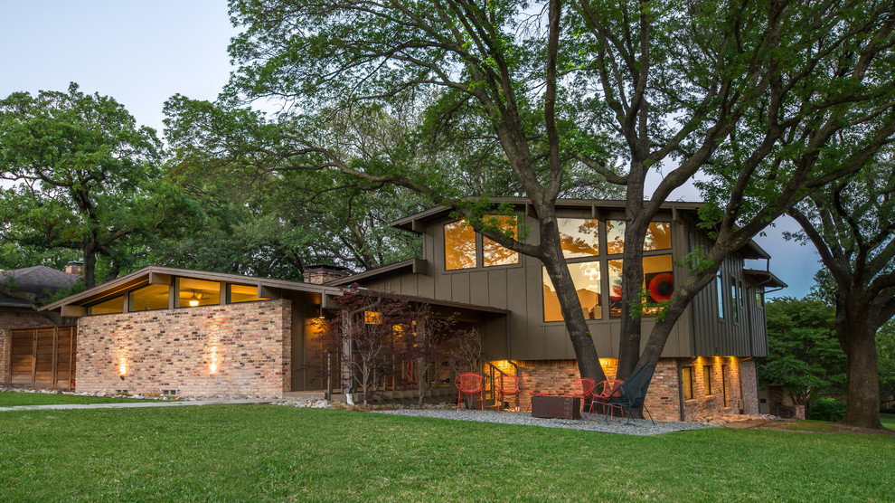Mid-sized 1960s brown two-story mixed siding exterior home idea in Dallas with a shingle roof