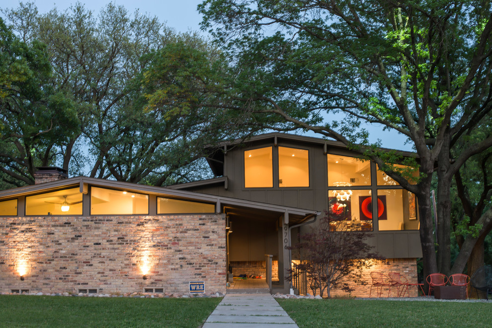 Example of a mid-sized mid-century modern brown two-story mixed siding exterior home design in Dallas with a shingle roof