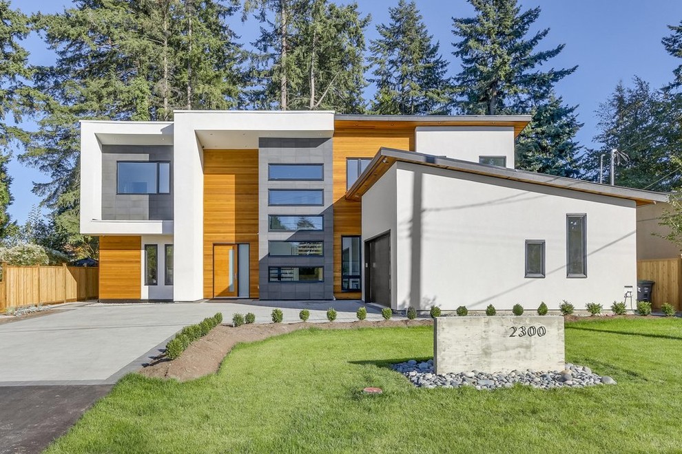 Example of a large trendy two-story mixed siding exterior home design in Vancouver