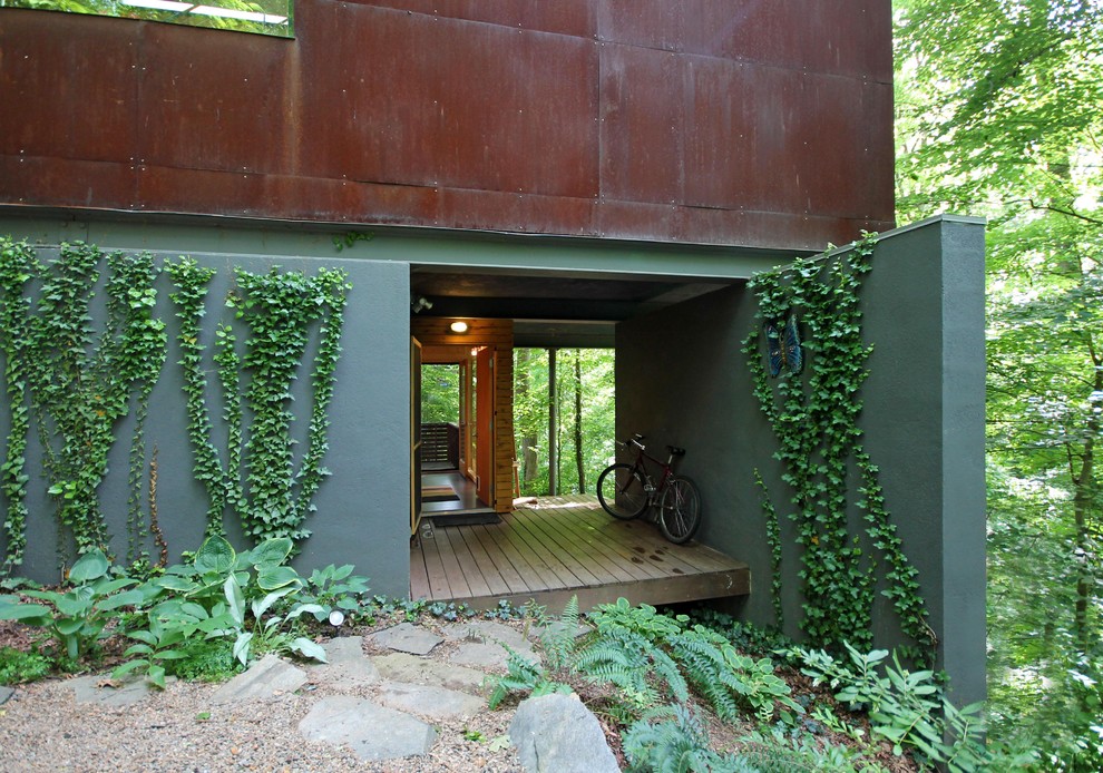 Идея дизайна: дом в стиле модернизм с облицовкой из бетона