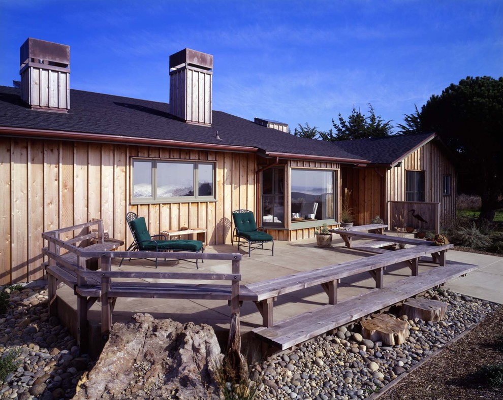 Design ideas for a rustic house exterior in San Francisco with wood cladding.