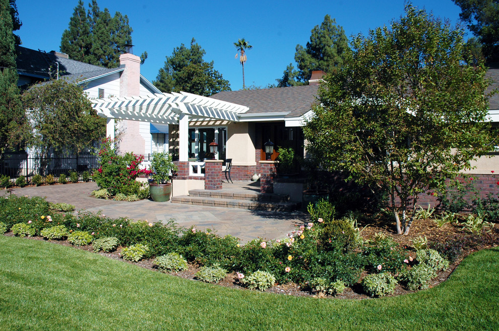 Example of a large eclectic beige one-story mixed siding exterior home design in Orange County