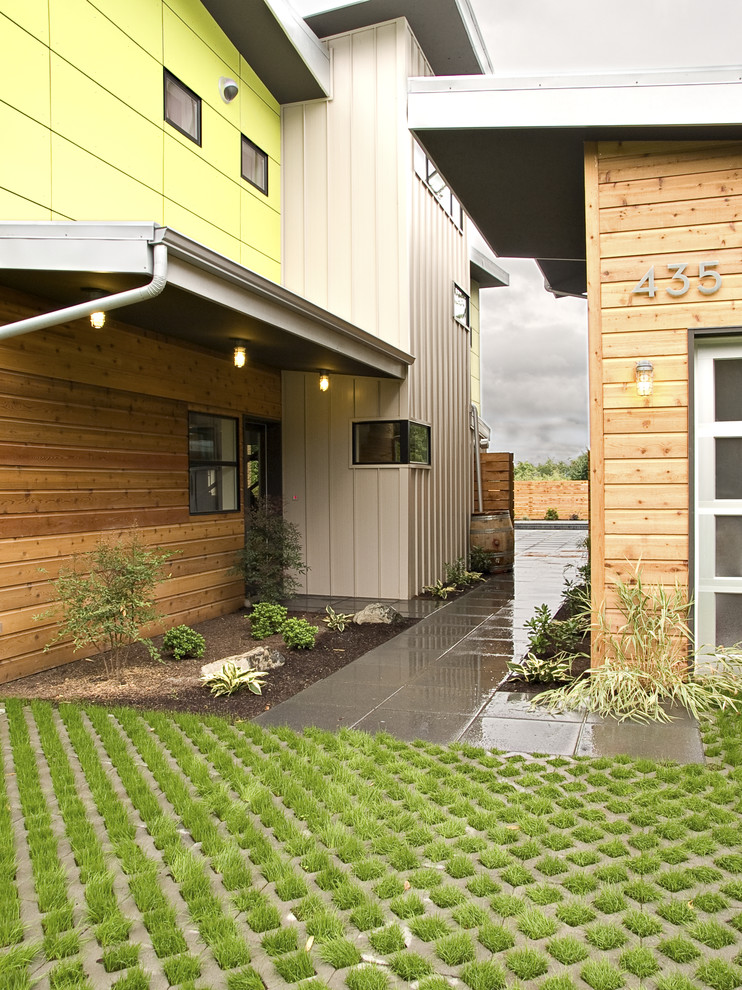 Design ideas for a contemporary house exterior in Seattle with wood cladding.