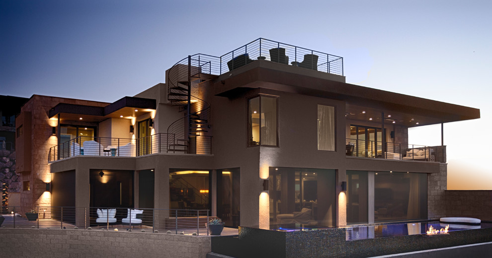 Imagen de fachada de casa marrón minimalista extra grande de dos plantas con revestimiento de estuco y tejado plano