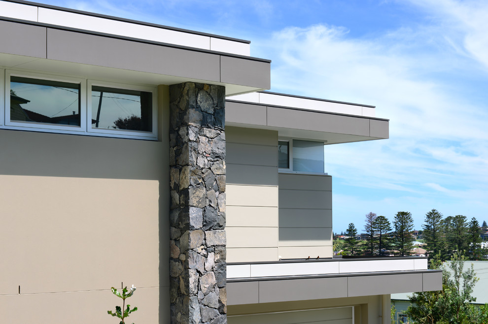 Inspiration for a modern two floor house exterior in Wollongong with concrete fibreboard cladding.