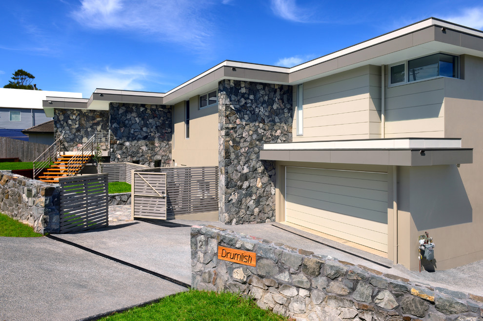 This is an example of a modern two floor house exterior in Wollongong with stone cladding.