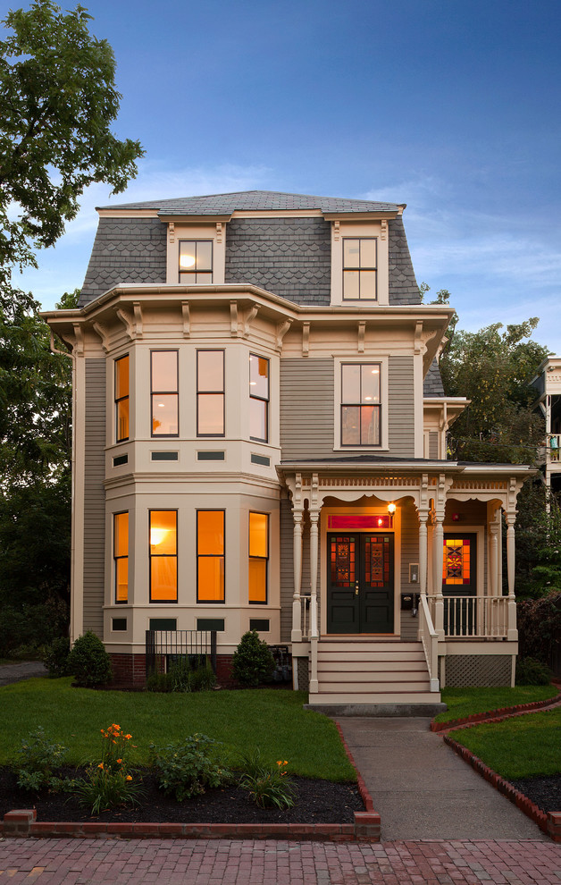 Mid-sized victorian gray three-story wood exterior home idea in Boston with a hip roof