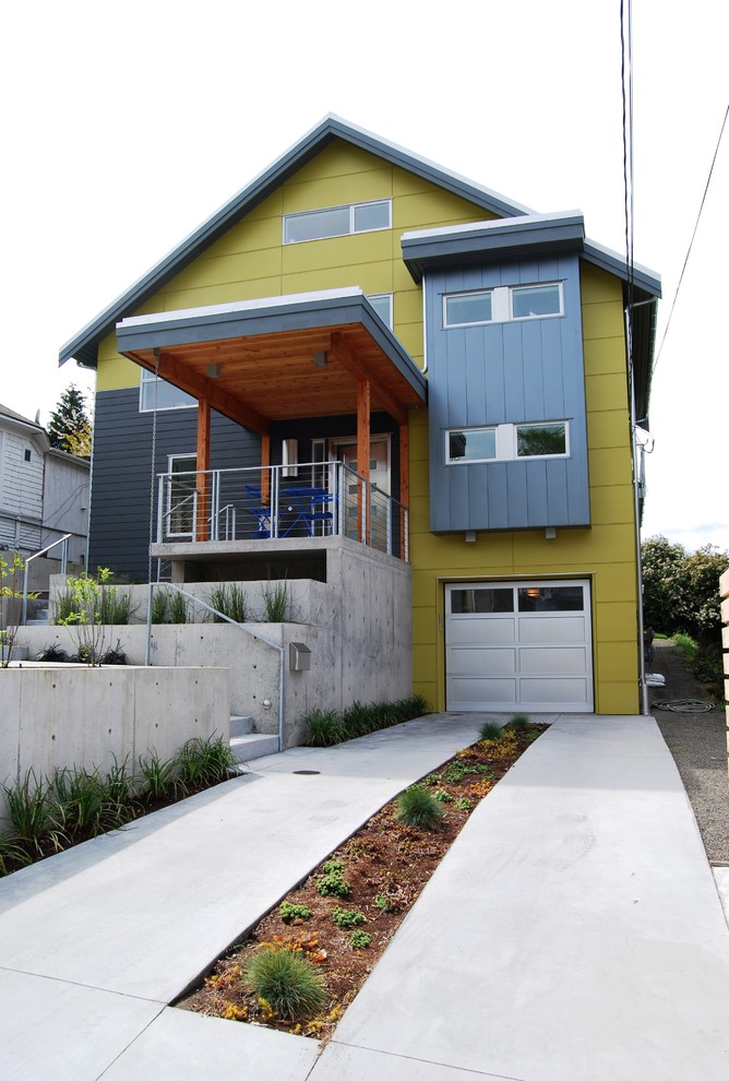 Design ideas for a contemporary house exterior in Seattle with three floors and mixed cladding.