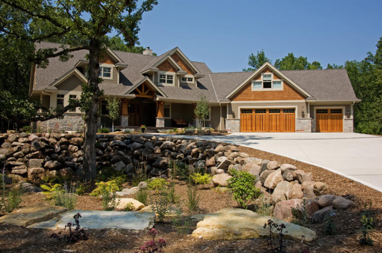 Inspiration for a large craftsman beige two-story mixed siding exterior home remodel in Minneapolis with a shingle roof