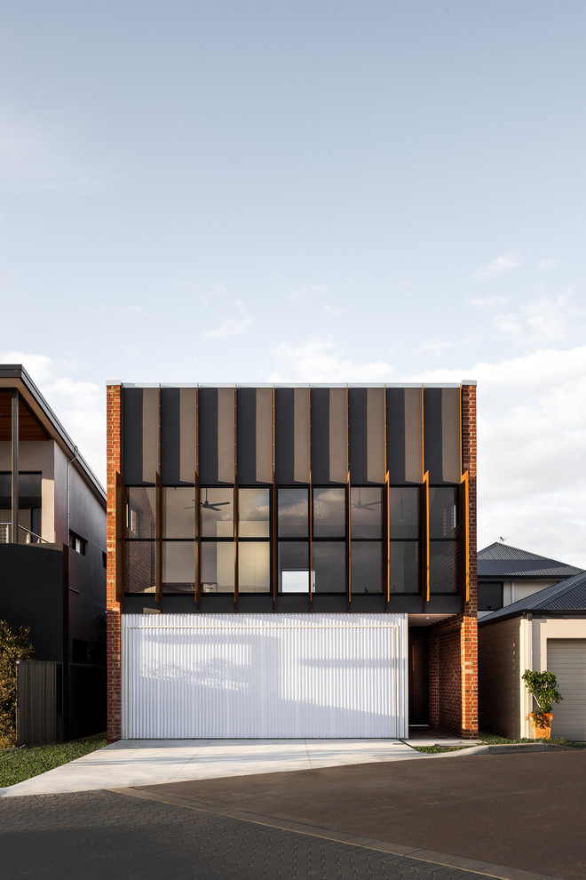 Design ideas for a medium sized industrial two floor house exterior in Perth.