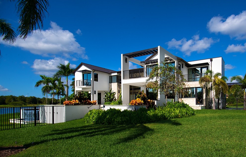Large and white contemporary house exterior in Miami.