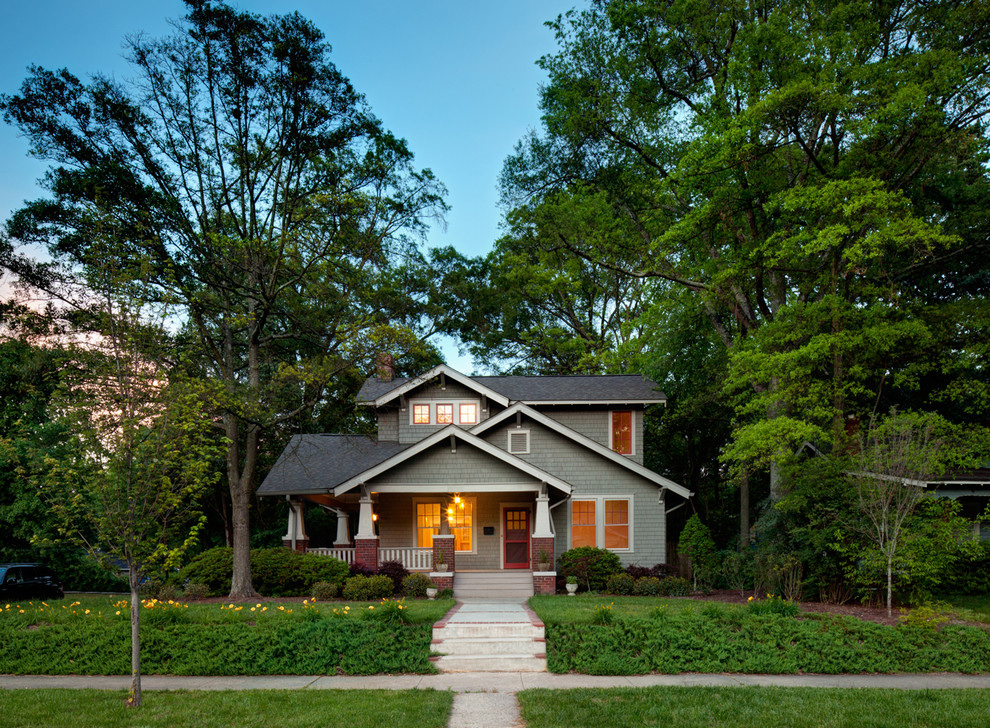 Inspiration for a traditional two floor house exterior in Charlotte with a pitched roof and a shingle roof.