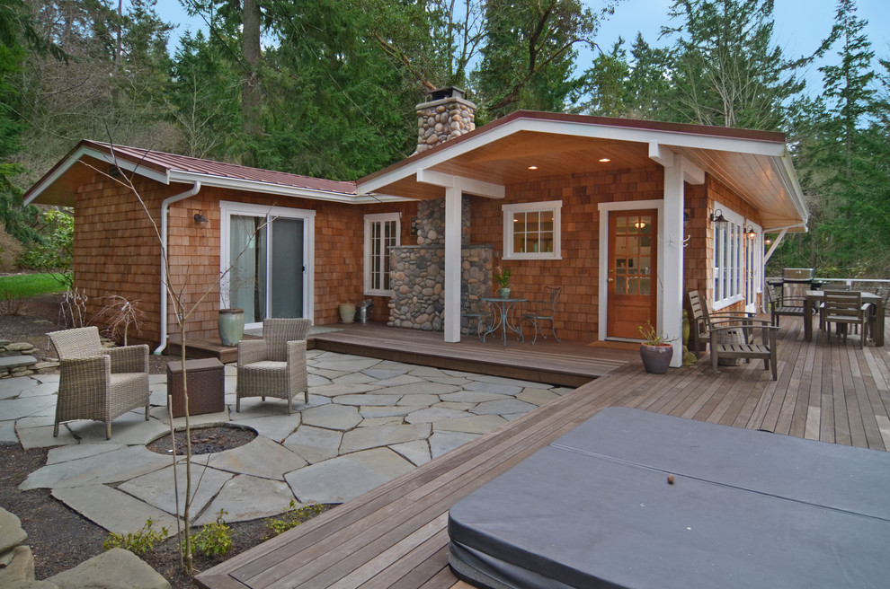 Inspiration for a medium sized rustic bungalow house exterior in Seattle with wood cladding.