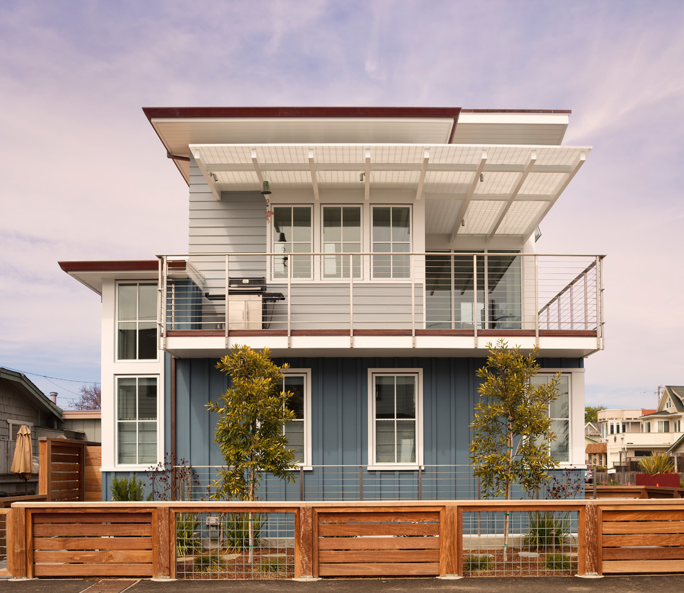 Inspiration for a small and multi-coloured beach style two floor detached house in Sacramento with mixed cladding, a lean-to roof and a mixed material roof.