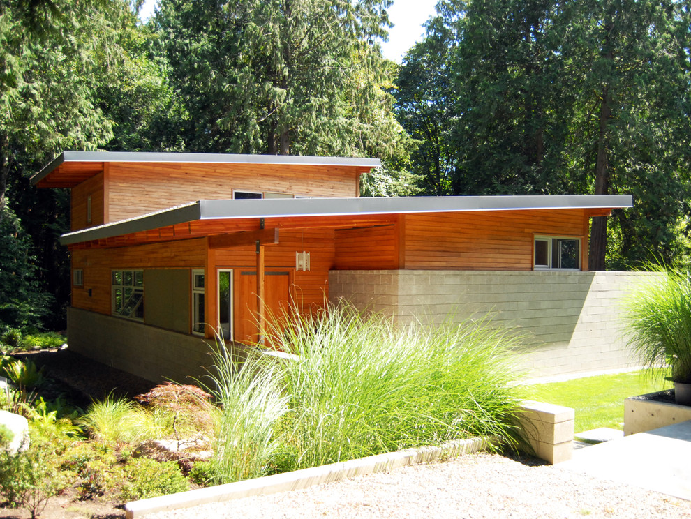 Modern wood flat roof idea in Seattle