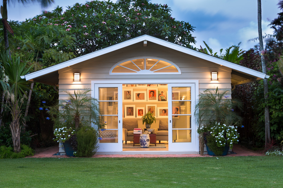 Inspiration for a small coastal beige one-story wood gable roof remodel in Hawaii