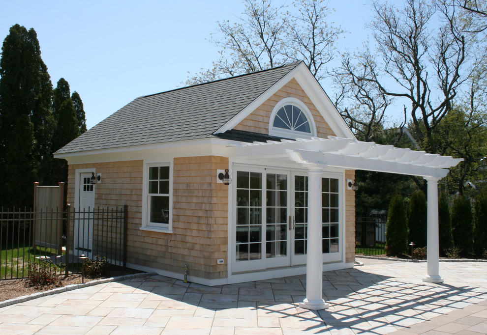 Inspiration for a small coastal one-story wood gable roof remodel in Providence with a shingle roof
