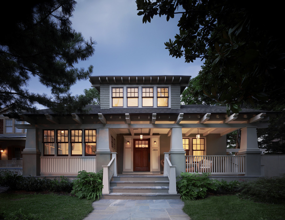 Example of an arts and crafts green two-story exterior home design in DC Metro