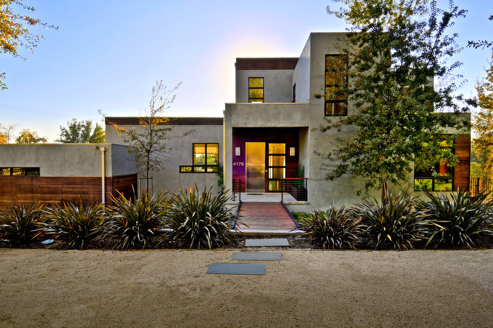 Inspiration for a modern two-story concrete exterior home remodel in Sacramento