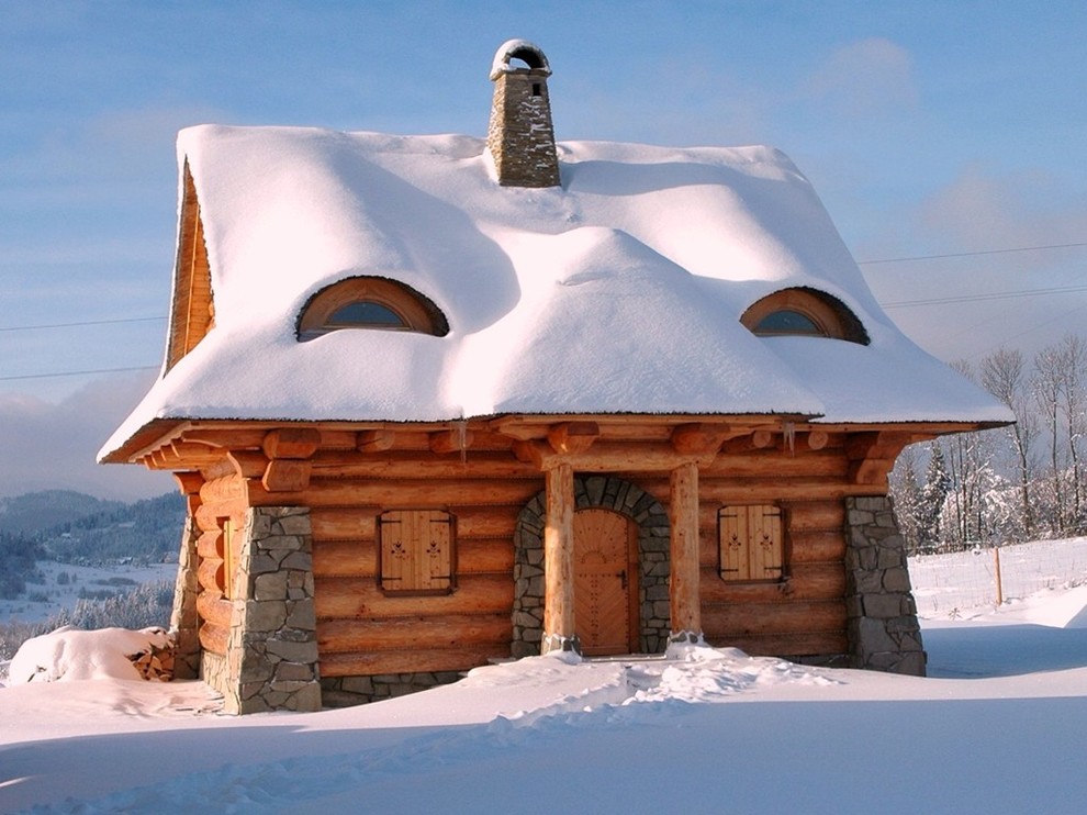 This is an example of a small rustic house exterior in Other with a pitched roof.