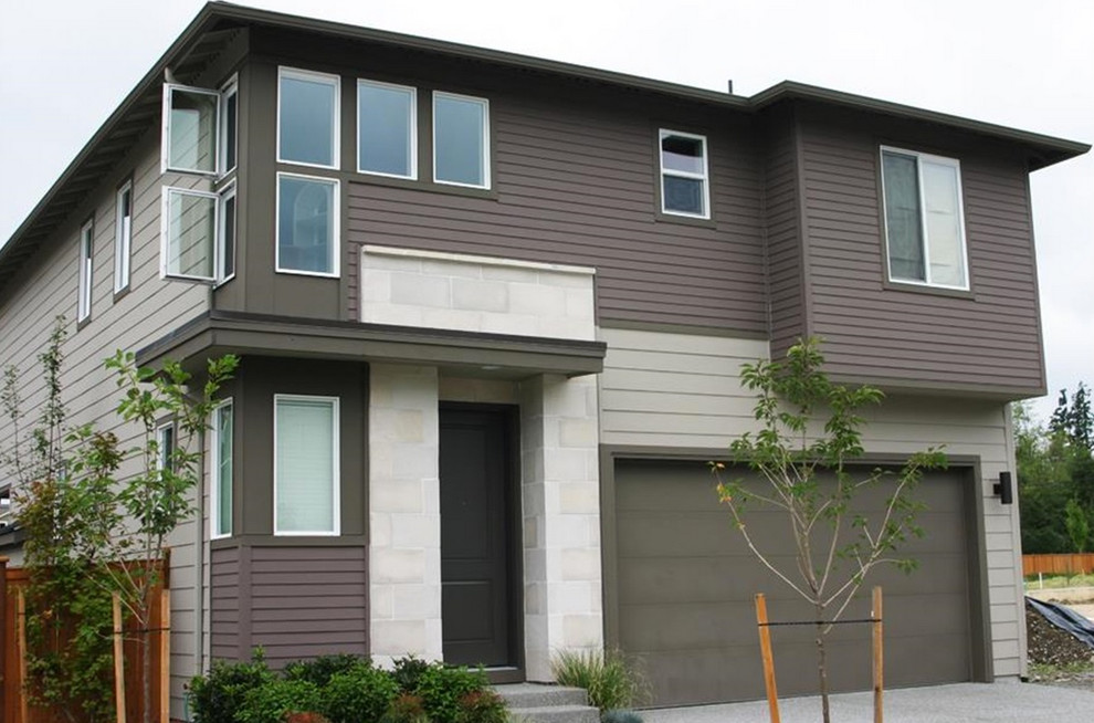 Example of an arts and crafts brown two-story exterior home design in Seattle