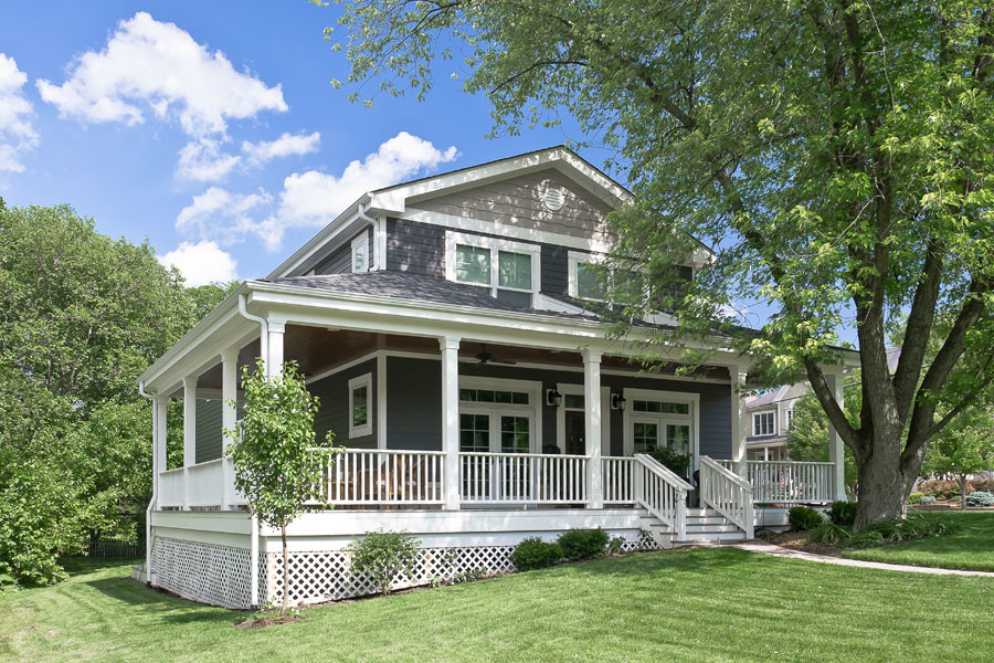 Example of a mid-sized transitional gray two-story mixed siding and clapboard exterior home design in Chicago with a shingle roof and a gray roof