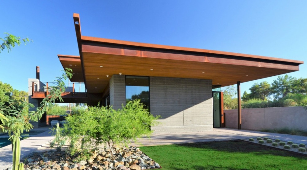 Example of a minimalist brown wood house exterior design