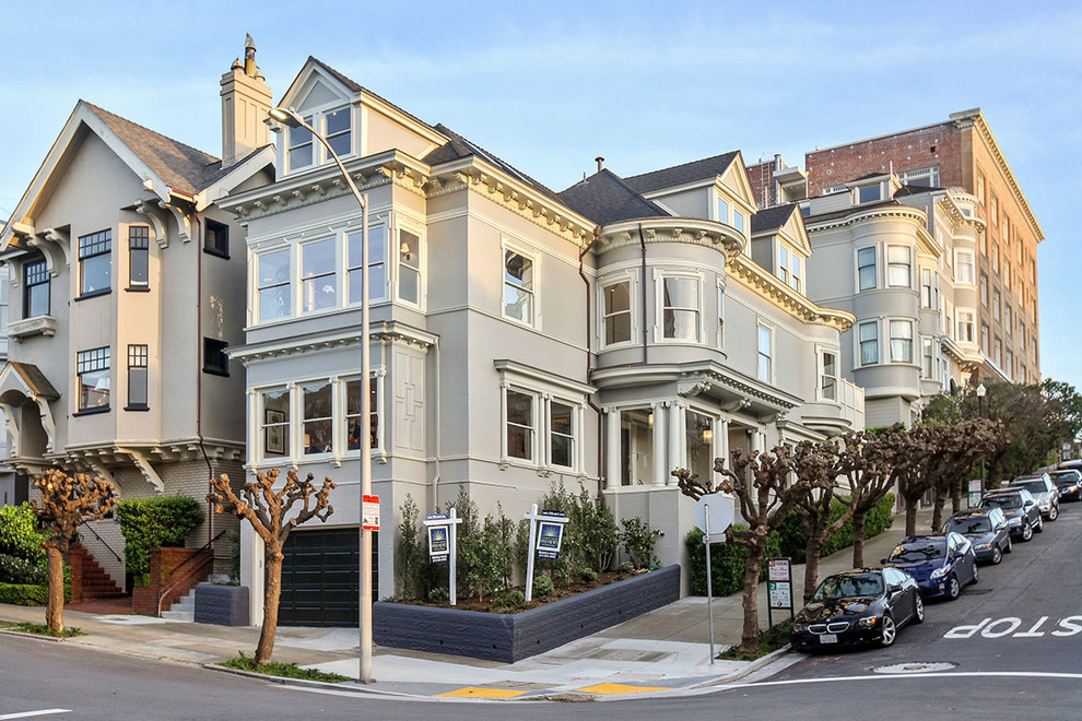 Inspiration for an expansive and gey victorian house exterior in San Francisco with three floors, wood cladding and a pitched roof.