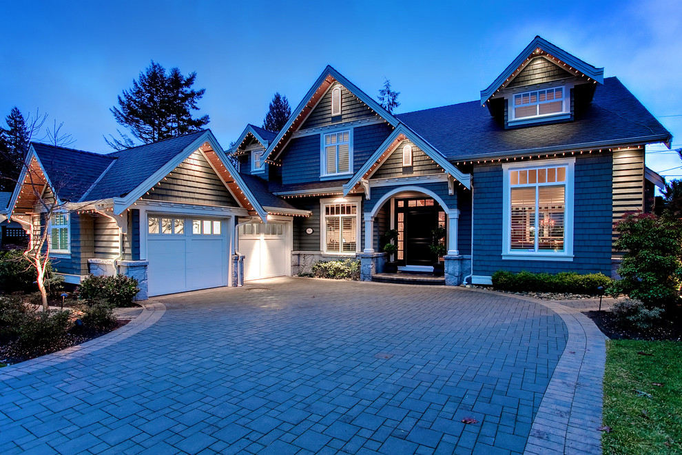 Inspiration for a mid-sized timeless two-story wood gable roof remodel in Vancouver