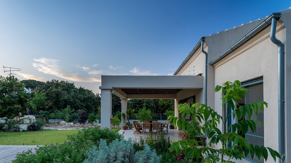 Example of a mid-sized tuscan beige two-story stone exterior home design in Tel Aviv