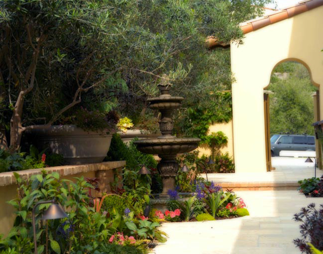 Inspiration for a large mediterranean brown one-story brick exterior home remodel in Orange County
