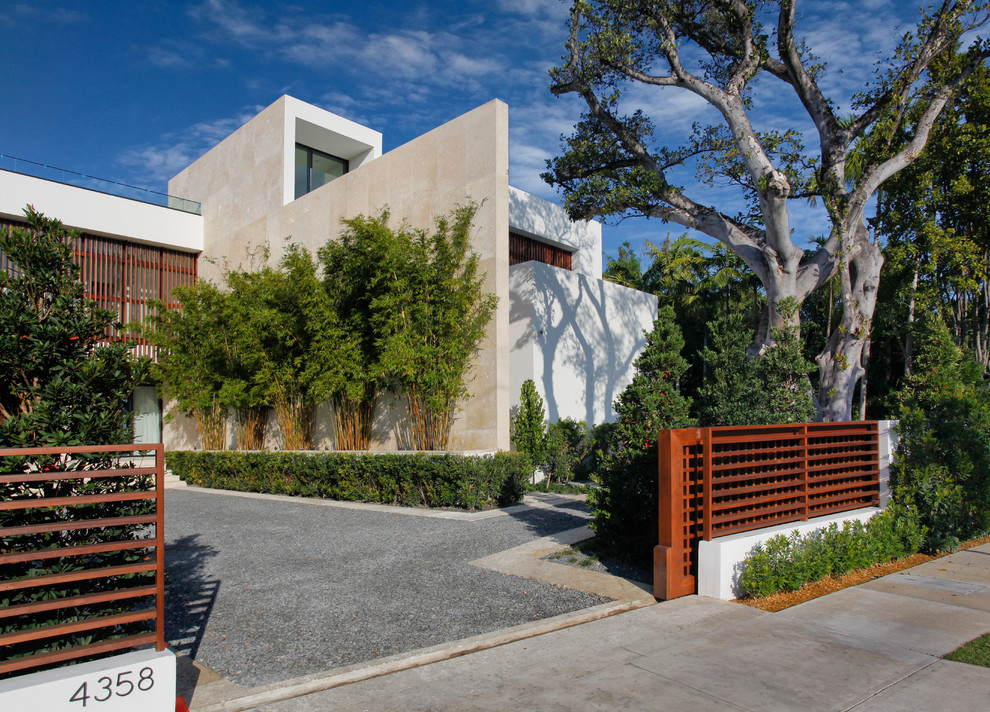 Design ideas for a large and white modern two floor detached house in Miami with a flat roof.