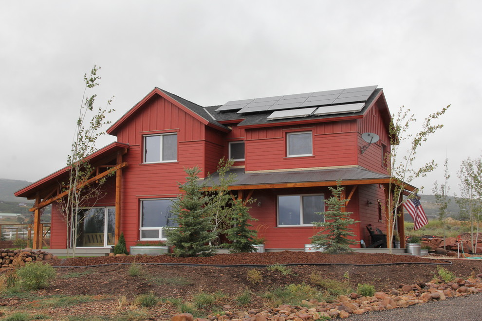 Medium sized and red farmhouse two floor house exterior in Salt Lake City.