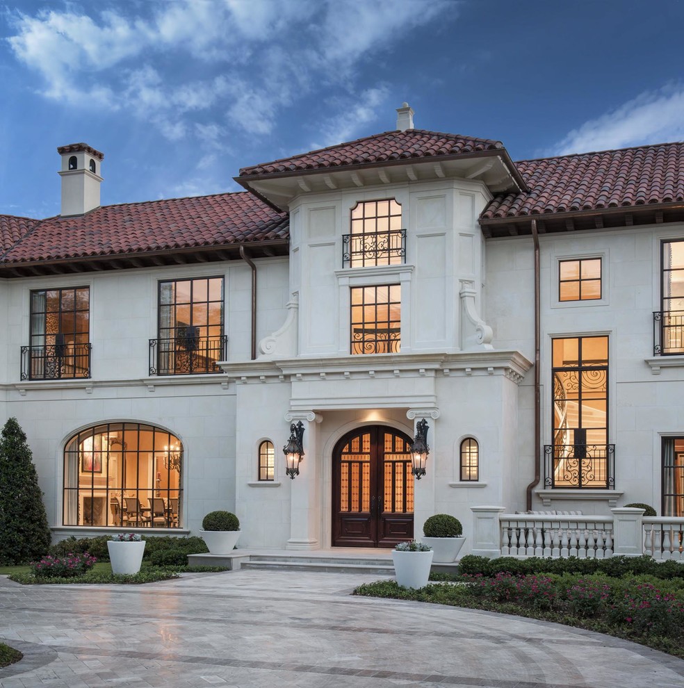 Photo of an expansive mediterranean two floor house exterior in Dallas.