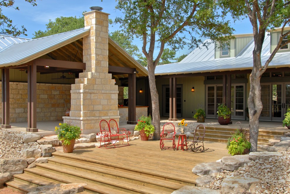 Example of a cottage two-story wood exterior home design in Austin
