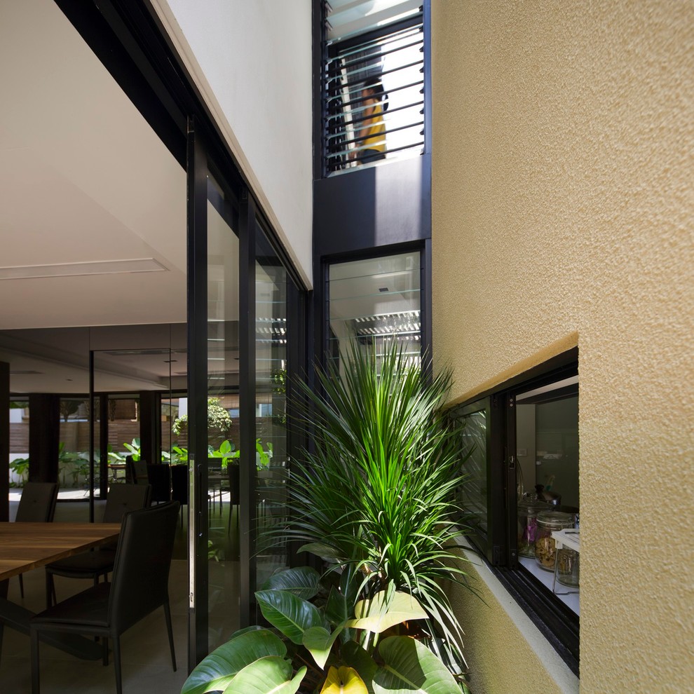 Inspiration for a small contemporary two-story exterior home remodel in Singapore